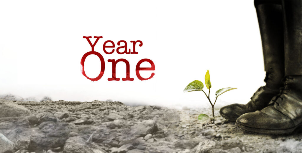 Artwork for Year One a play by Erik Gernand. A pair of black boots stand next to a growing sapling