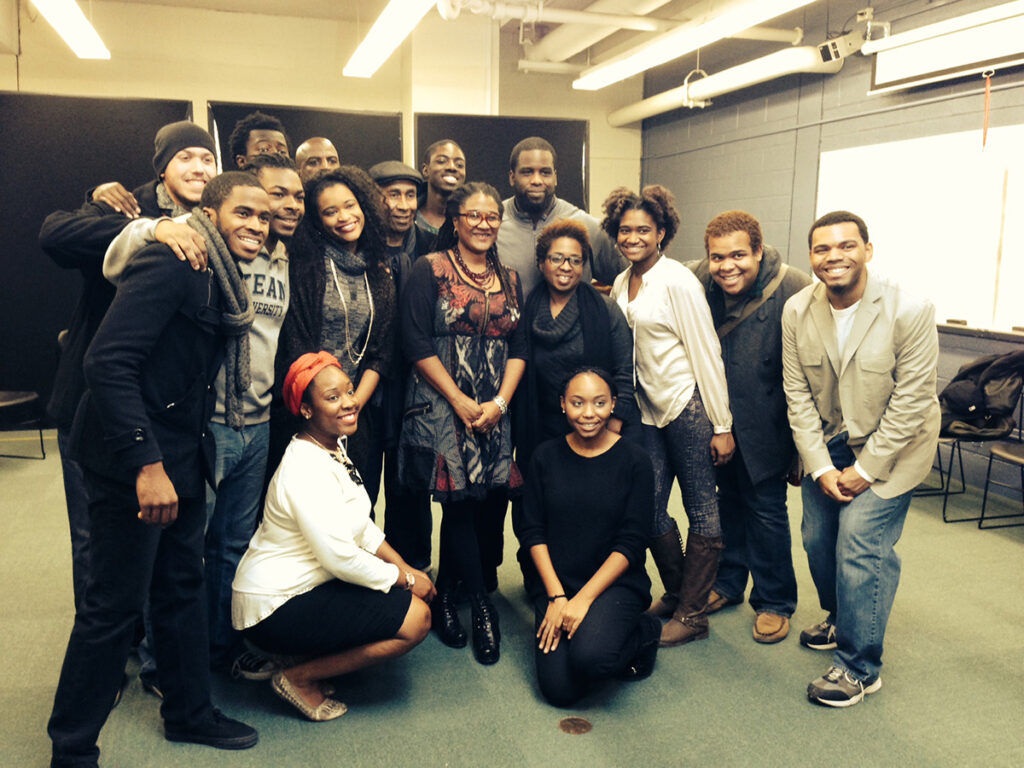 Playwright Lynn Nottage gathers with a group of students.