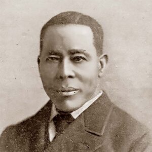 a headshot of William Still, A sepia-toned vintage portrait of an African American man, dressed in formal attire typical of the late 19th or early 20th century. The image captures a dignified and composed expression, highlighting the historical significance and cultural context of the era.